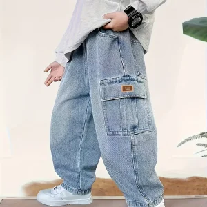 Boy's loose-fit stylish denim work pants with label design, comfortable elasticized waist, and trendy versatile style.